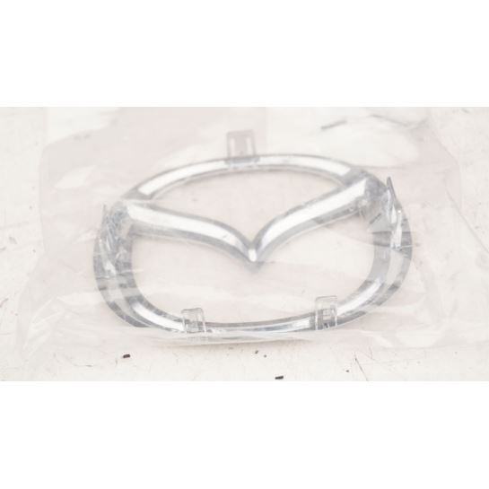 Embleman w przedni zderzak Mazda 5 nowy oryginał